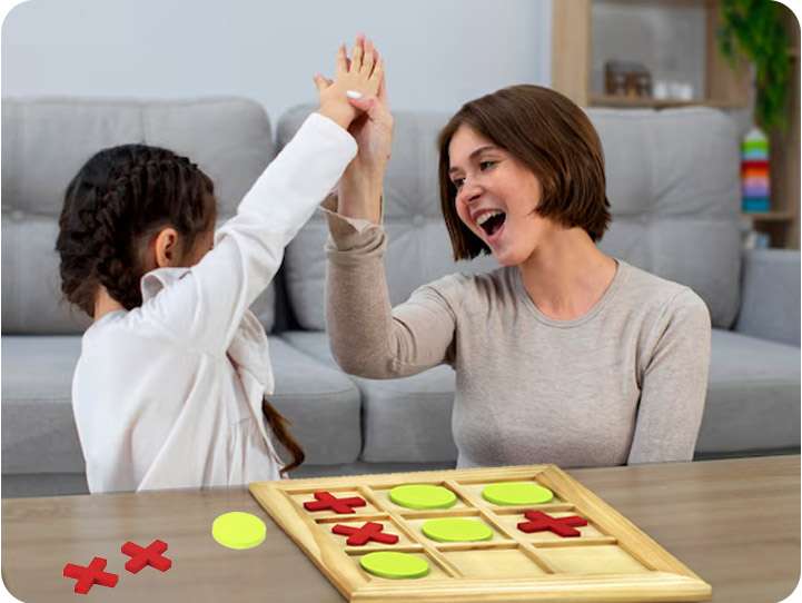 mother kid playing tictactoe